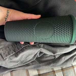 Dark green studded Starbucks tumbler
